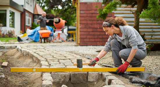 HELOC-blog_woman-with-pavers_thumbnail HELOC-blog_woman-with-pavers_thumbnail